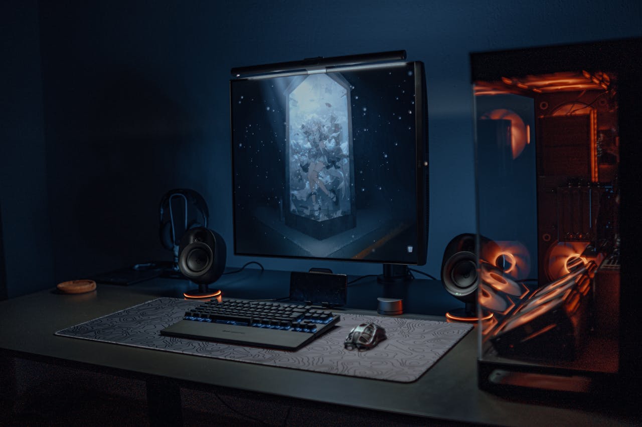 The Art of Drawing Readers In: Your attractive post title goes here A stylish gaming setup featuring a screen, keyboard, and PC with ambient lighting.