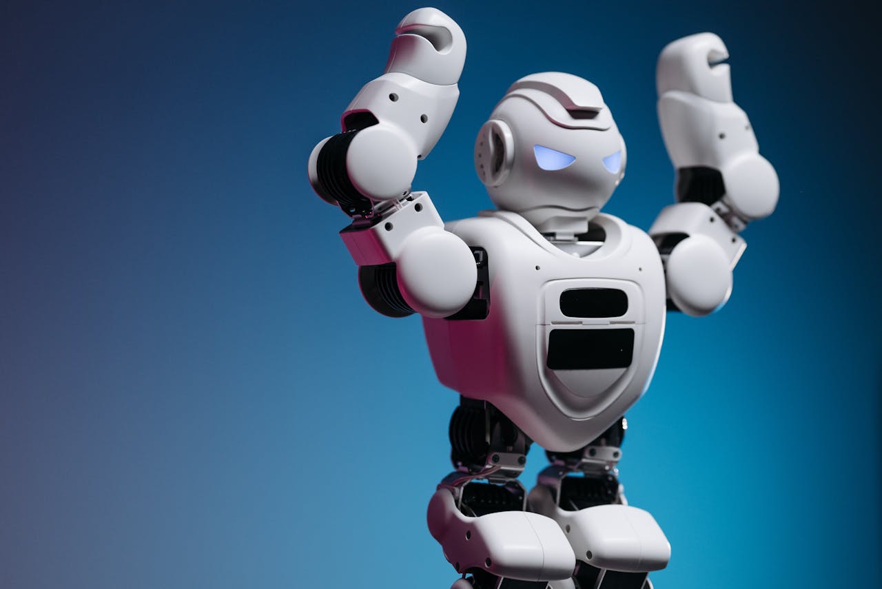 Services A white humanoid robot in a studio setting showcasing advanced robotics and modern technology.